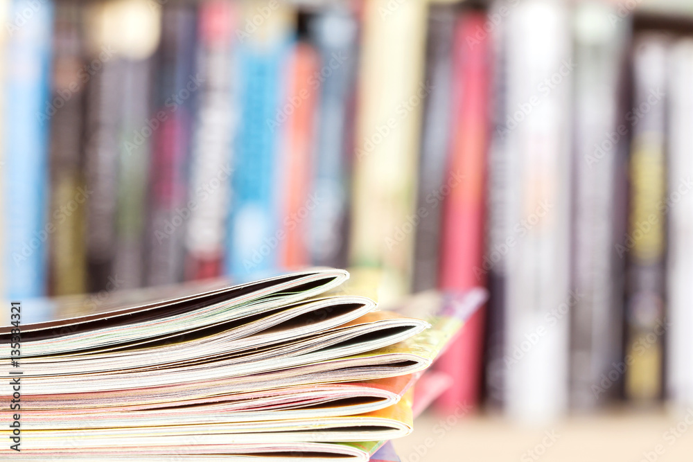 Close up edge of colorful magazine stacking 