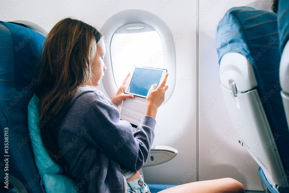 Child flying in airplane