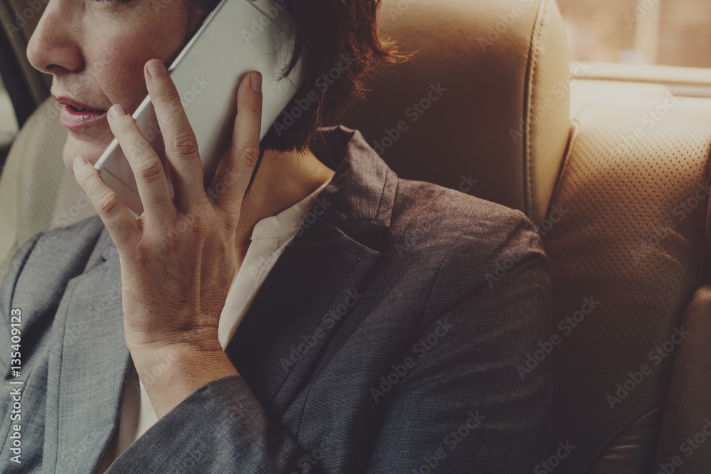 Businesswoman Talking Using Phone Car Inside