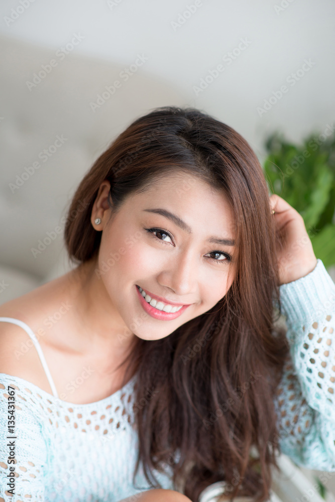 Asian pretty young woman relaxing at home.