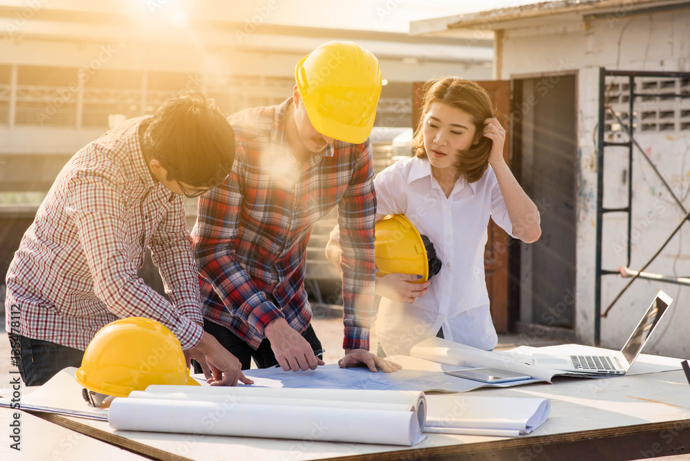 three construction engineers working outdoors in construction si