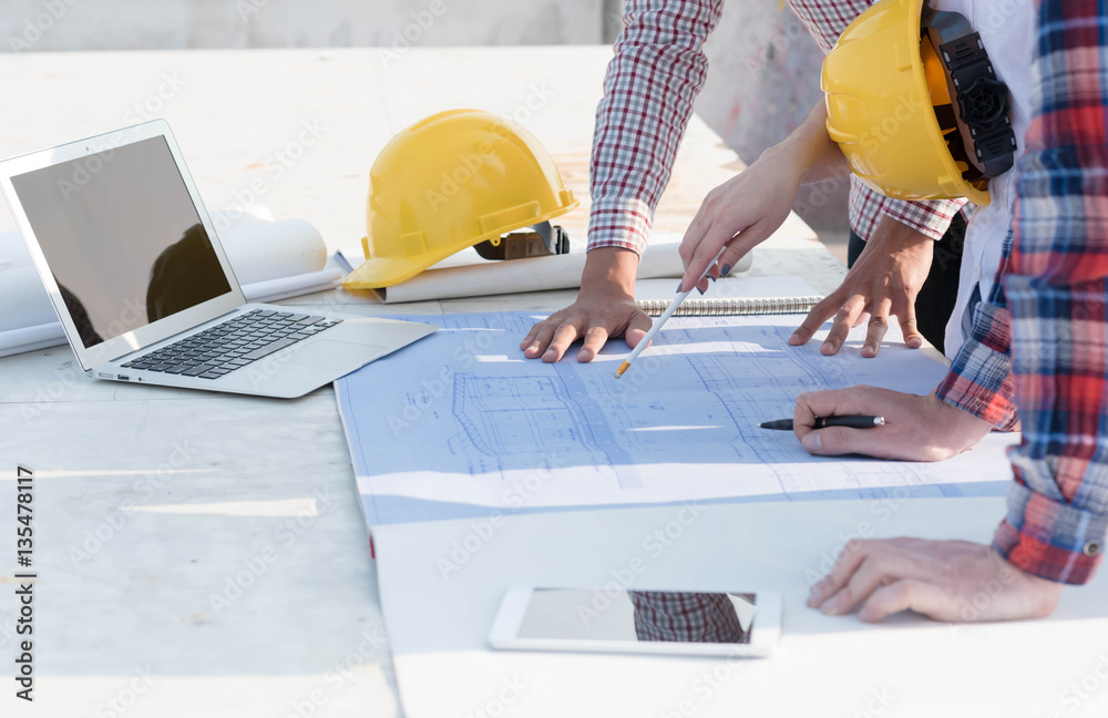 three construction engineers working outdoors in construction si