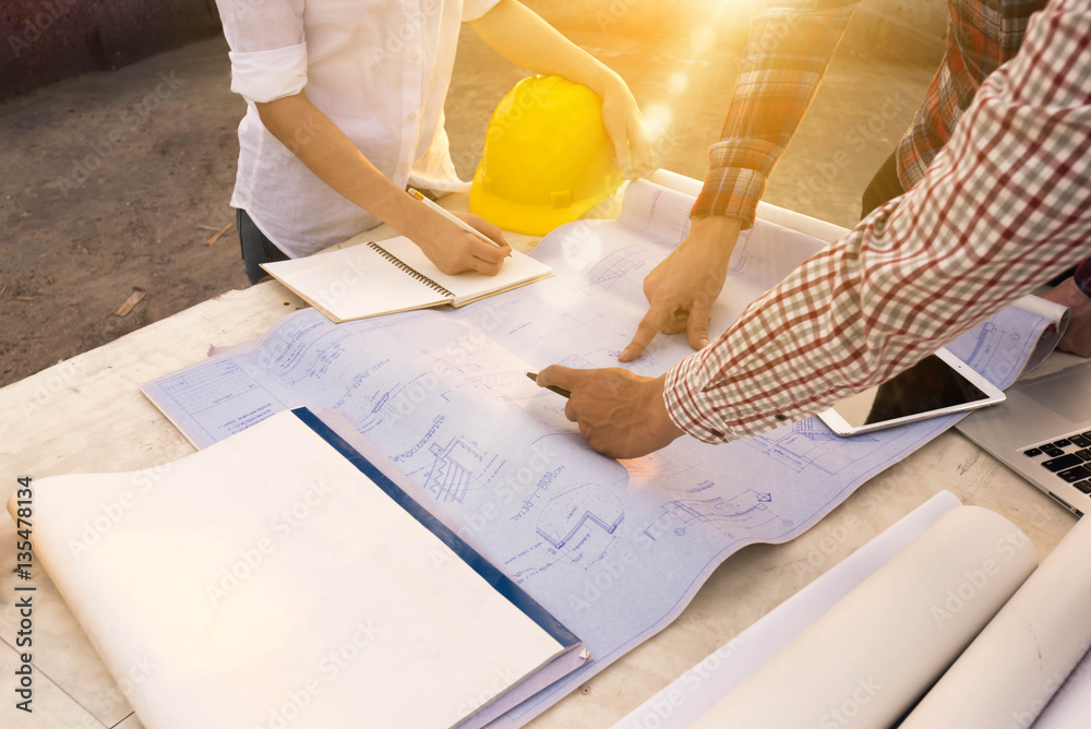 three construction engineers working outdoors in construction si