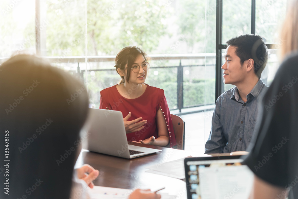 4 people meeting in coffee shop, business casual conceptual