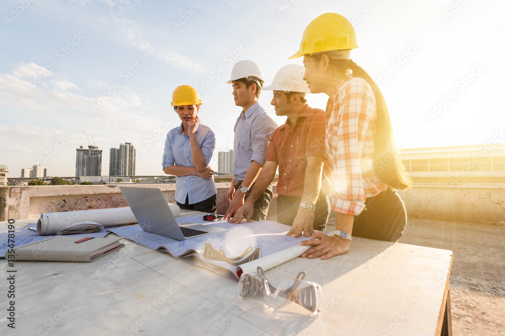 Three construction engineer working in construction site, constr