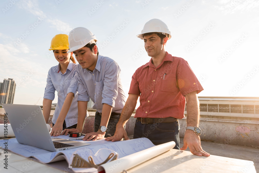 Three construction engineer working in construction site, constr