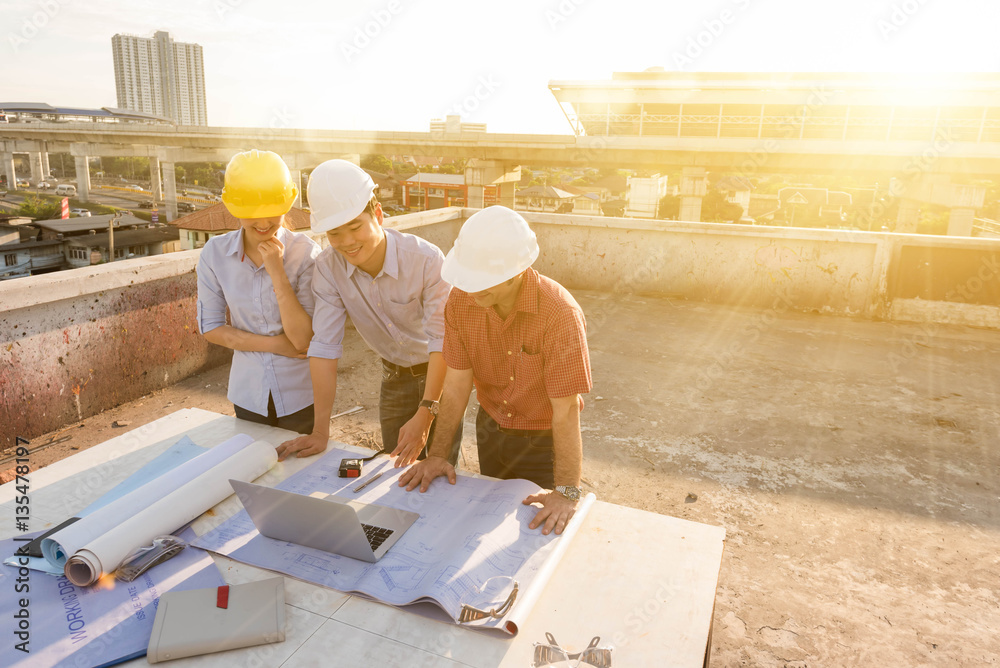 Three construction engineer working in construction site, constr