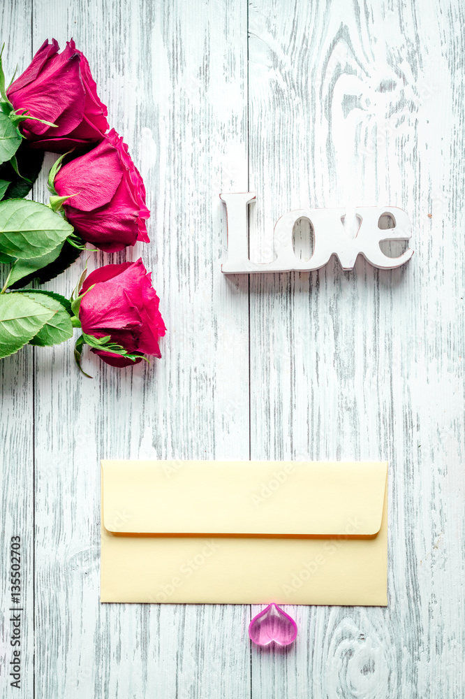 concept Valentines Day with flower wooden background top view