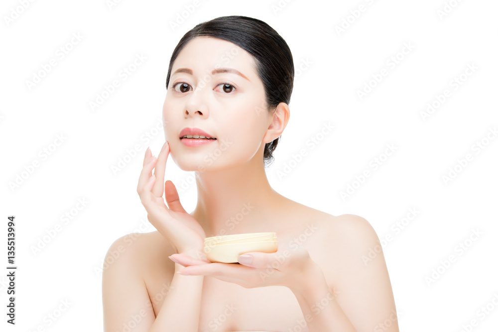 beauty asian woman applying facial lotion product on face