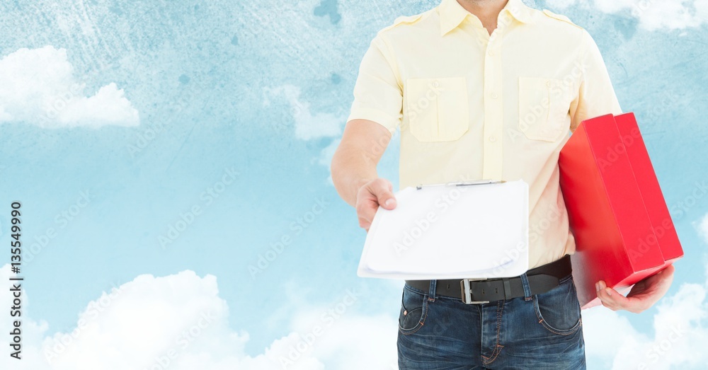 Mid section of delivery man holding clipboard and parcel box