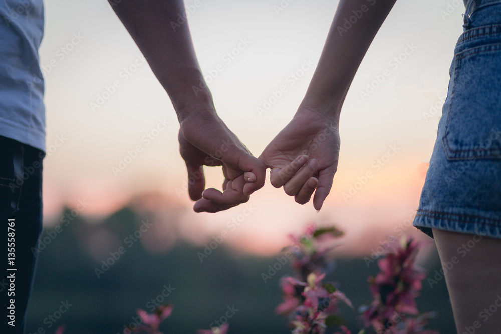 Couple in love holding hearts.