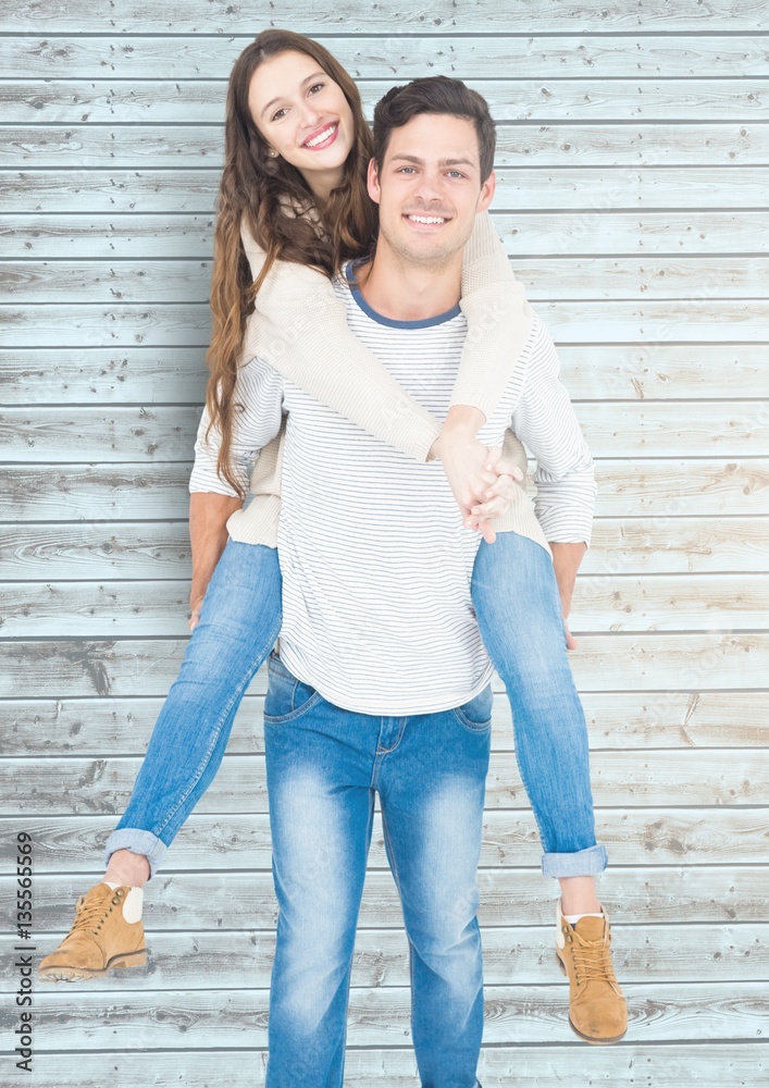 Man giving piggyback ride to woman