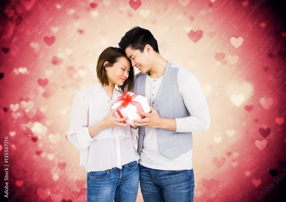 Man giving gift to woman