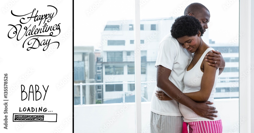 Man embracing pregnant woman and valentines text