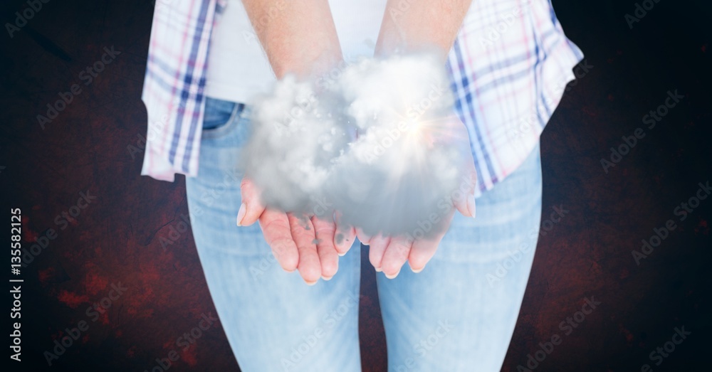 Mid-section of woman holding clouds