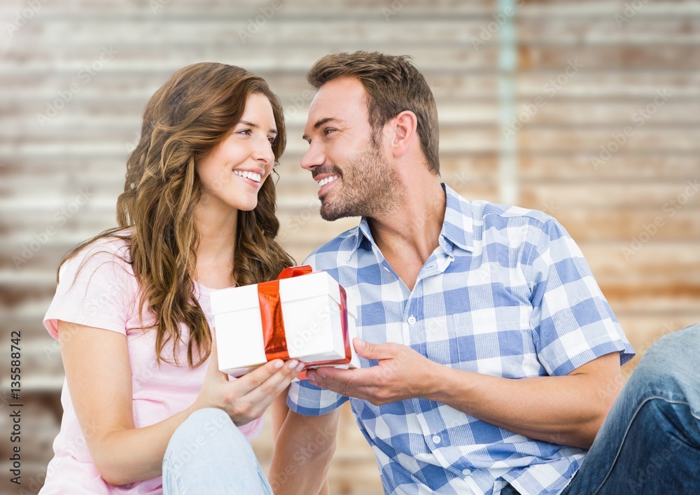 Man giving a gift to woman