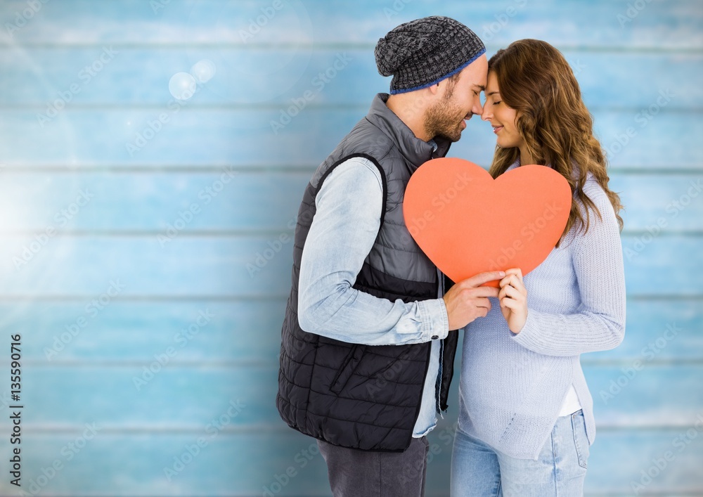 Romantic couple holding a heart