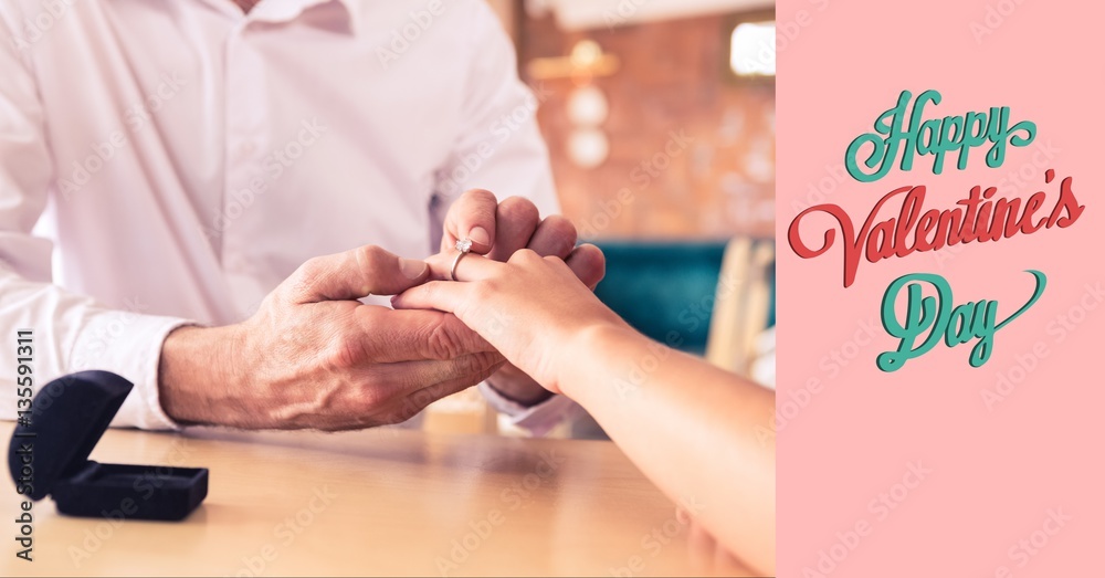 Man putting ring on womans finger and valentine text