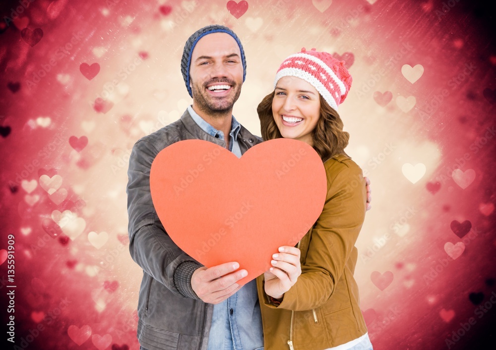 Romantic couple holding a heart