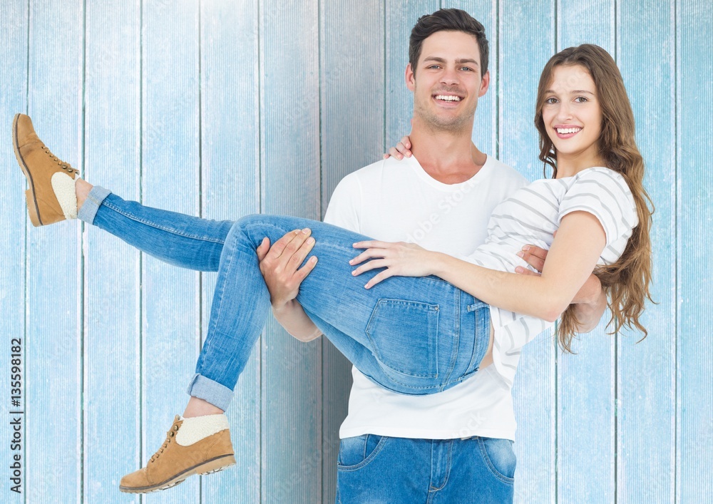 Portrait of happy man carrying his woman