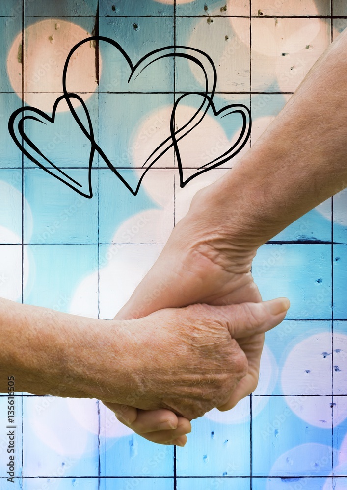 Close-up of senior couple holding hands