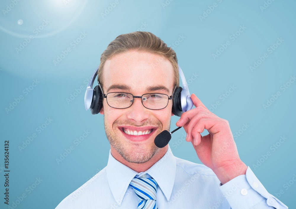 Portrait of smiling businessman with headset in office