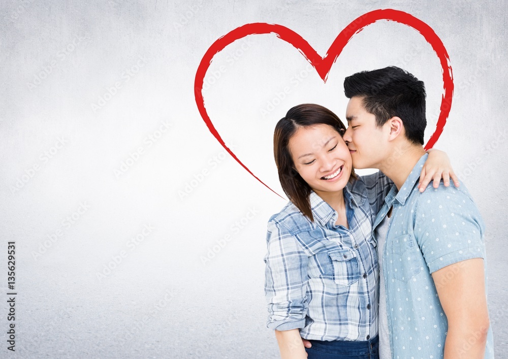 Romantic man kissing on her woman cheeks