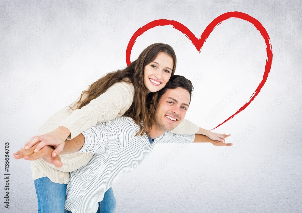 Man giving piggyback ride to woman