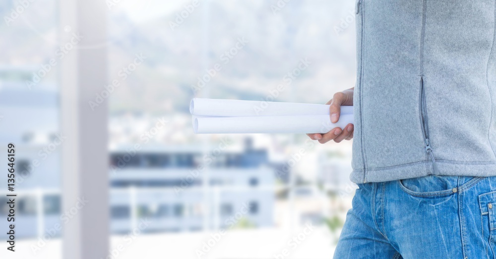 Construction man holding blueprint