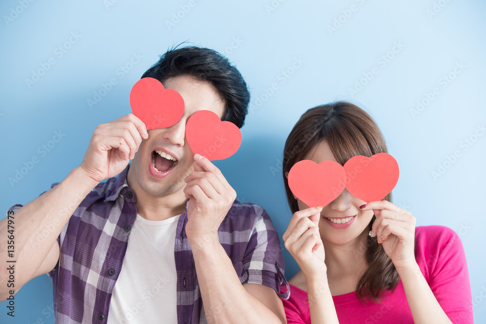 Happy couple holding love heart