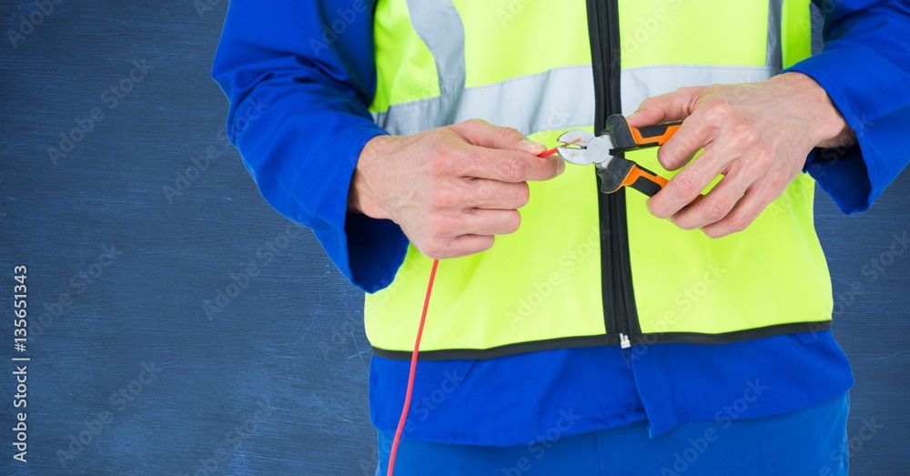 Mid section of handyman using pliers