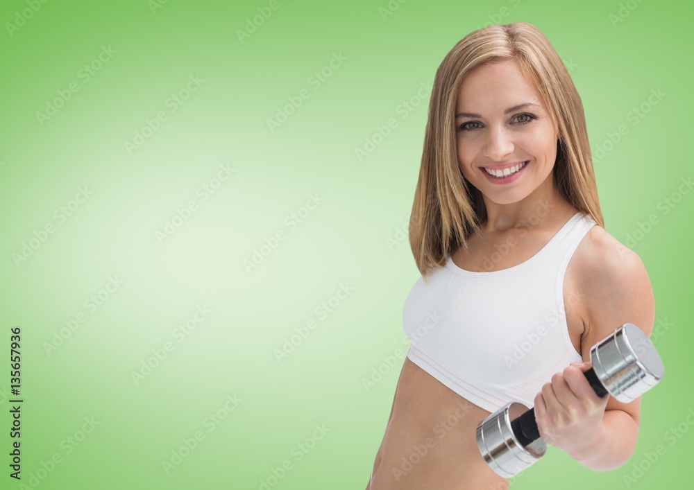 Beautiful woman exercising with dumbbell