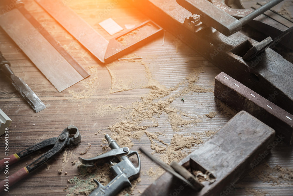 wood workshop with handcraft tools and raw wood on construction