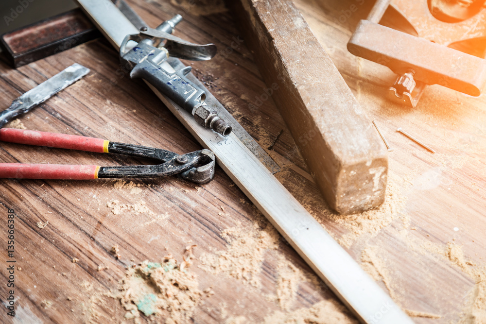 wood workshop with handcraft tools and raw wood on construction