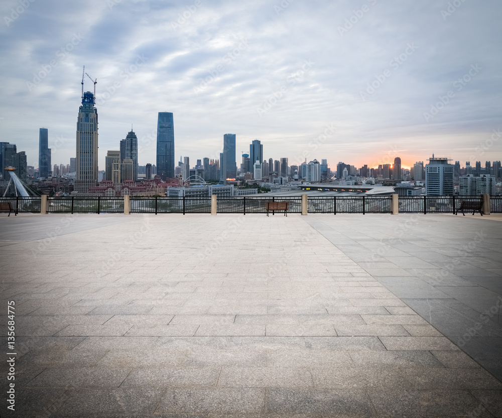 empty brick floor with cityscape and skyline