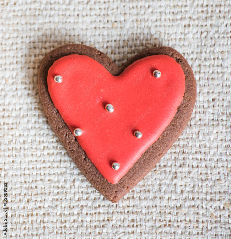 Heart shaped chocolate Valentines Day cookies with red and white glaze.