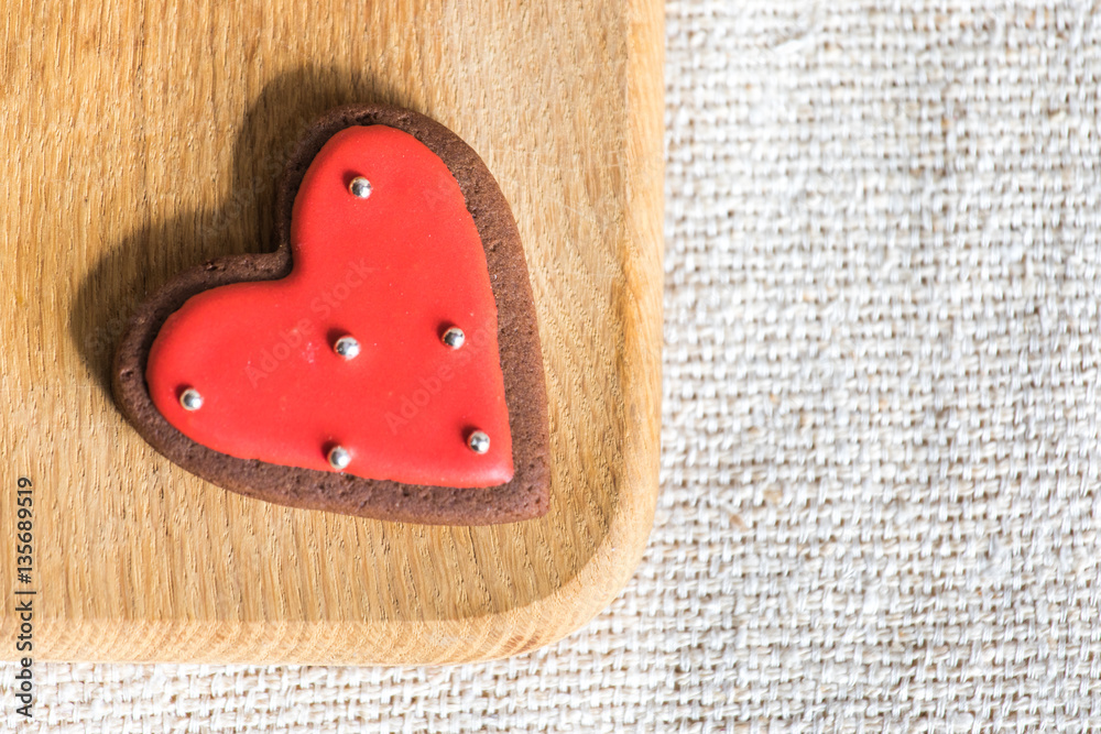 Heart shaped chocolate Valentines Day cookies with red and white glaze.