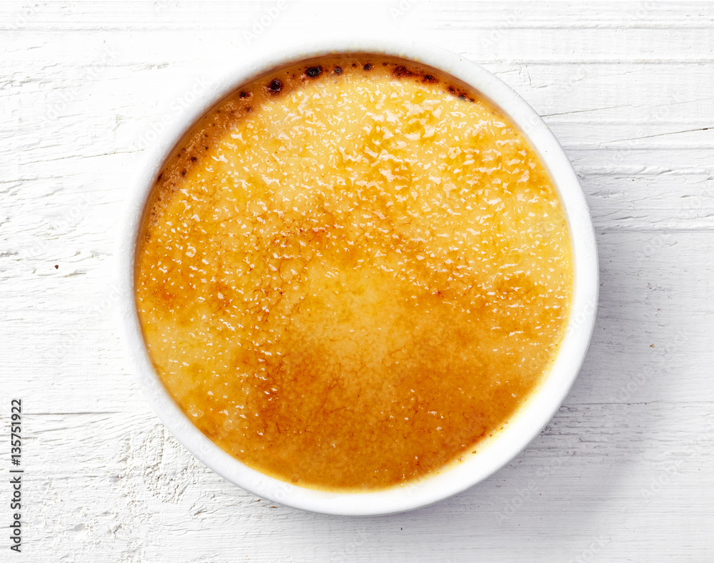 bowl of creme brule on white wooden table