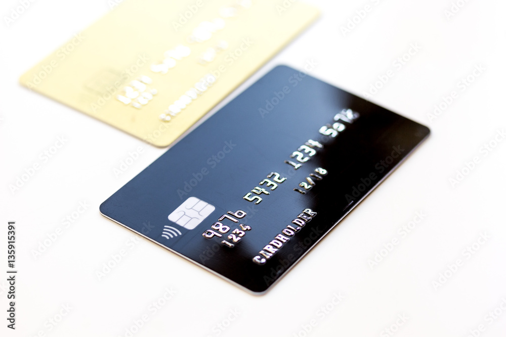 pile of credit cards on white background