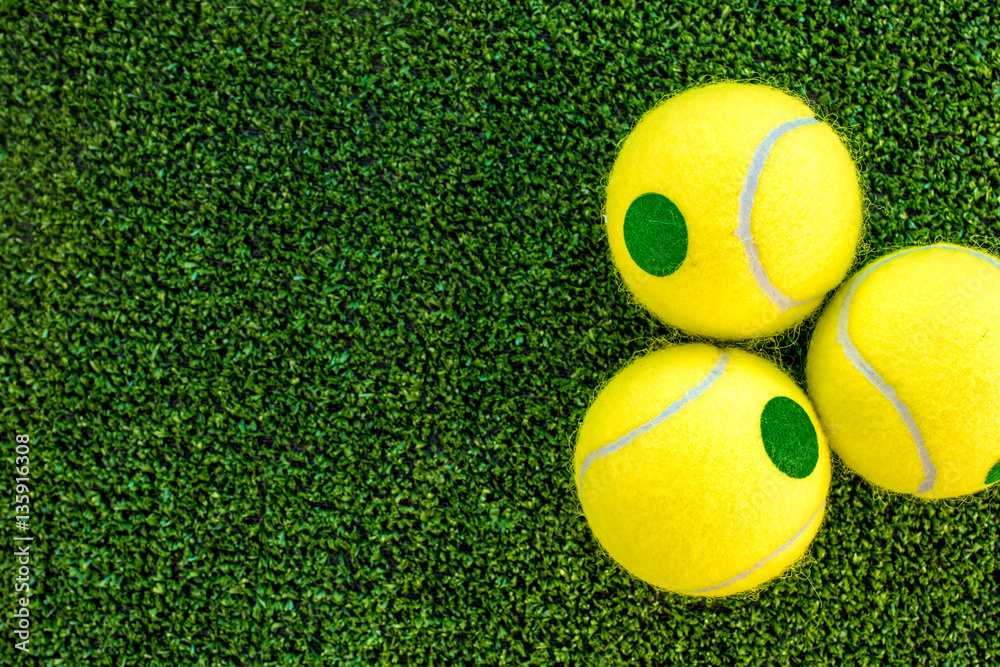 tennis ball on green background top view mock up