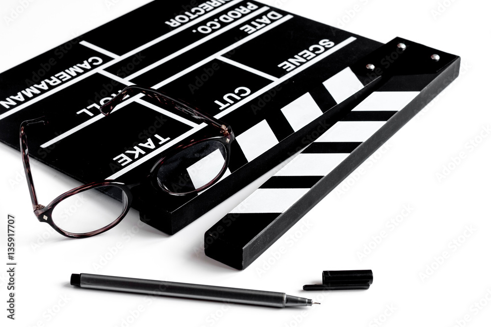 Screenwriter desktop with movie clapper board white background