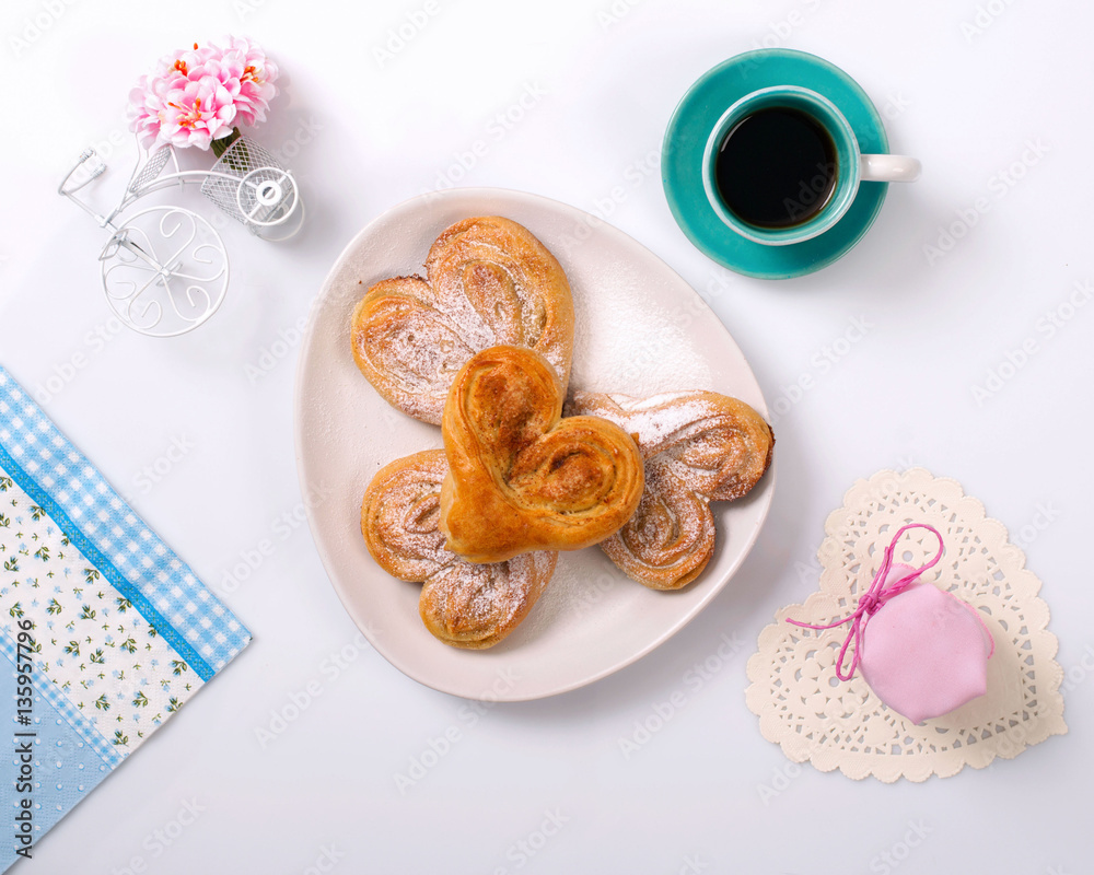 Cinnamon rolls, jam and coffee. Top view.