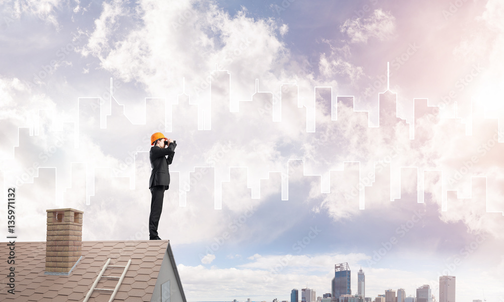 Engineer man standing on roof and looking in binoculars. Mixed media