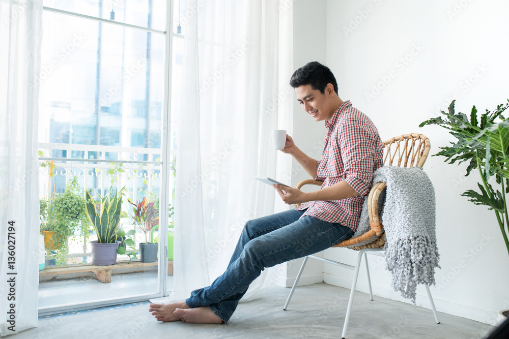 Portrait of a smiling man relaxing on the couch