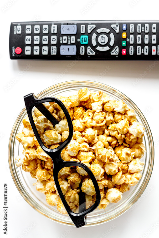 concept of watching movies with popcorn top view white background