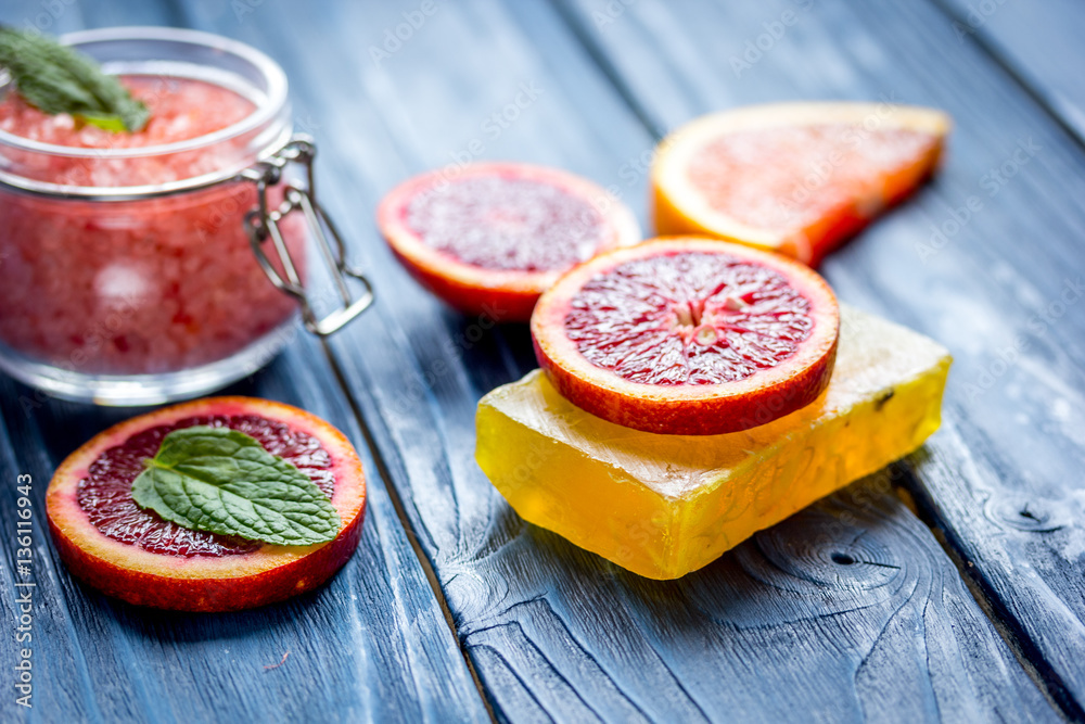 organic cosmetic with citrus on blue background