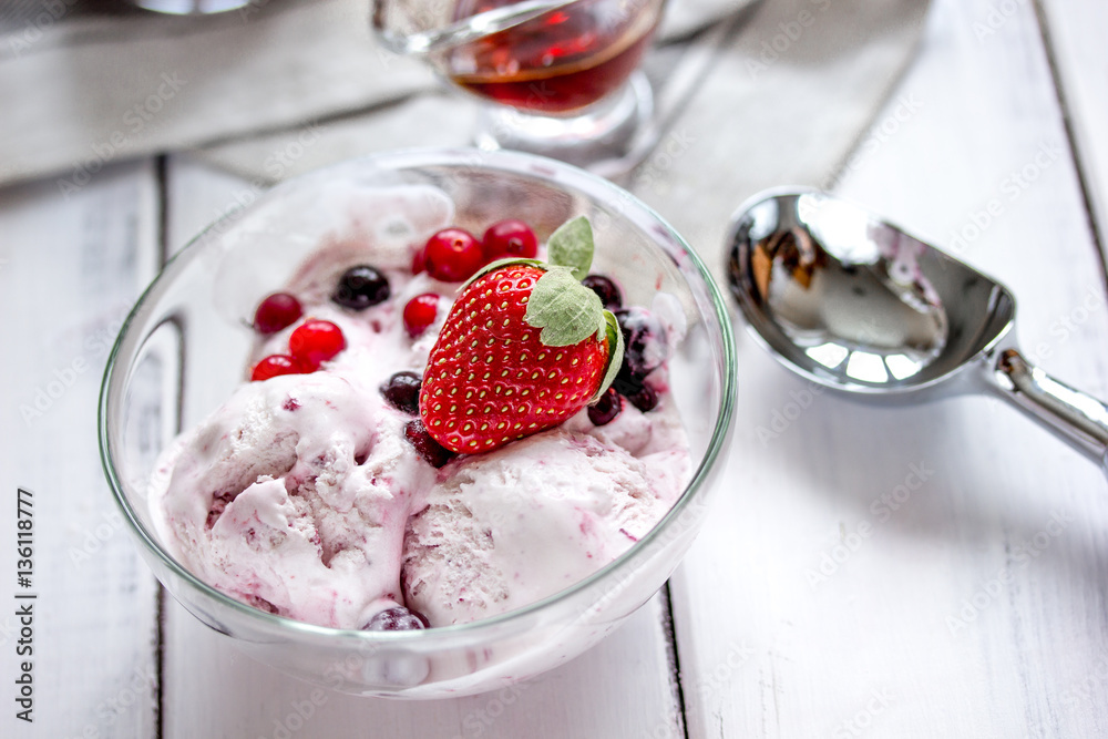 organic homemade ice cream in glass bowl on wooden background