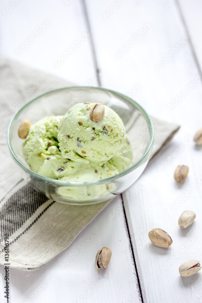 organic homemade ice cream in glass bowl on wooden background