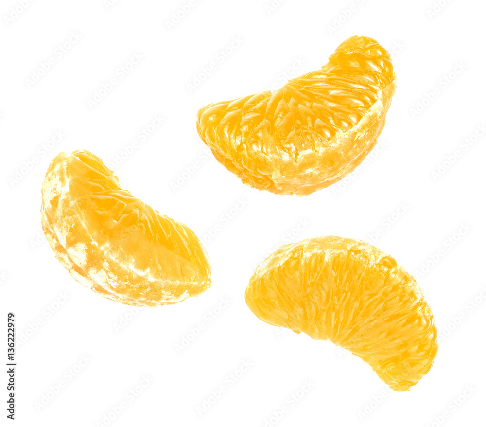 Isolated tangerine or clementine fruit on white background. Macro. Slice of mandarin. Top view.