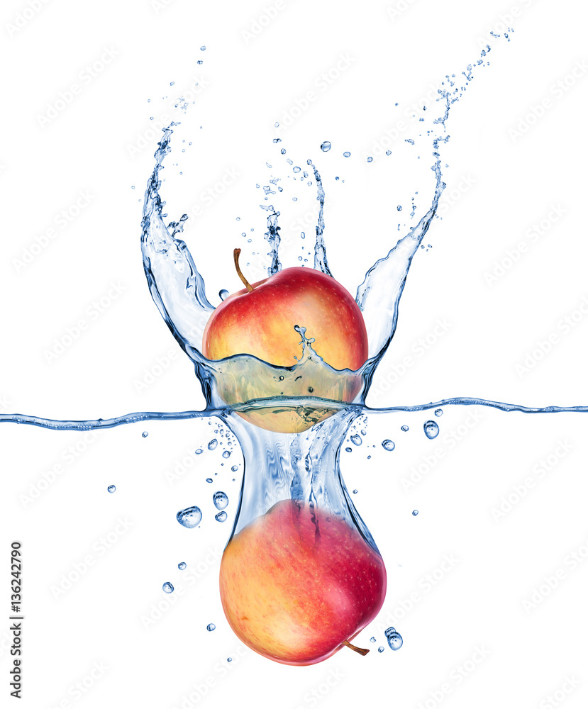 Apples falling under water with a splash on white background